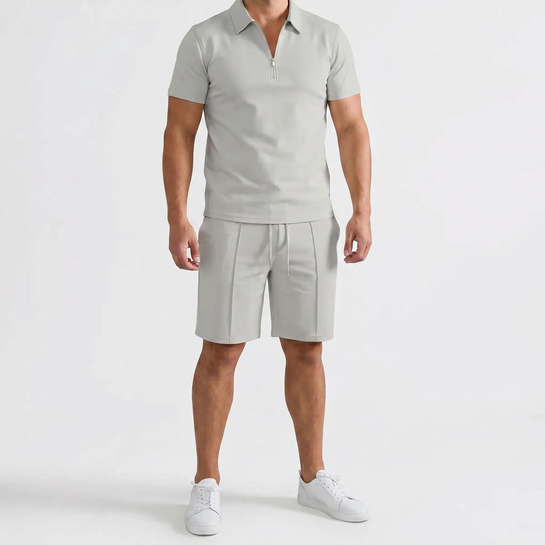 Complete men's summer casual outfit: a stylish zip neck polo shirt and comfortable matching shorts.