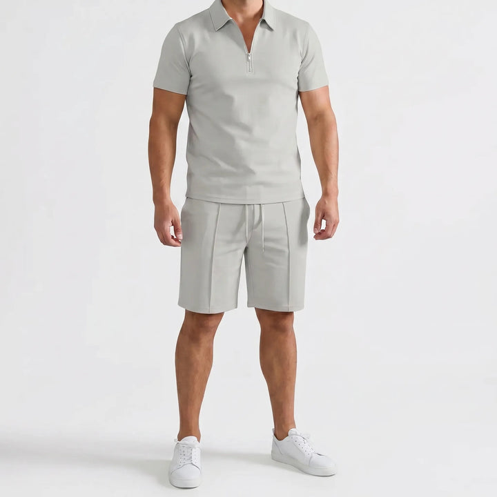 Complete men's summer casual outfit: a stylish zip neck polo shirt and comfortable matching shorts.