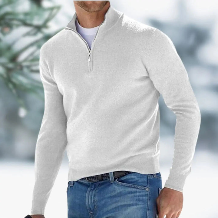 Close-up of a men's smart casual quarter-zip knit sweater, showing detailed fabric texture.