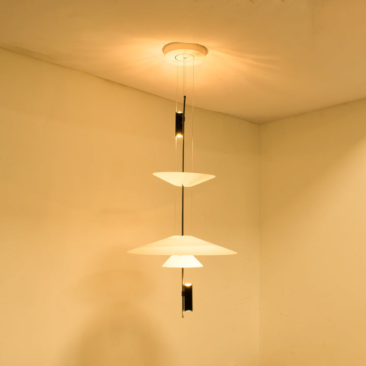Chic black Merru LED pendant, sculptural disc design for architectural lighting.