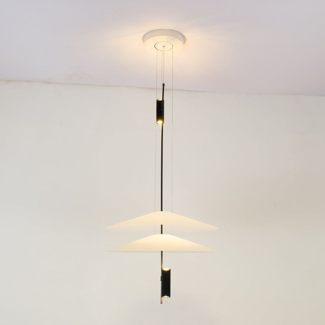 Close-up of Merru gold LED disc pendant light, showcasing intricate details.