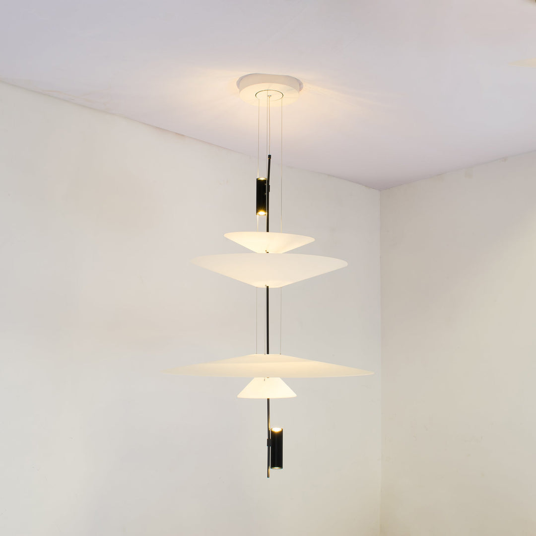 Merru gold modern disc LED pendant light, casting beautiful light patterns.