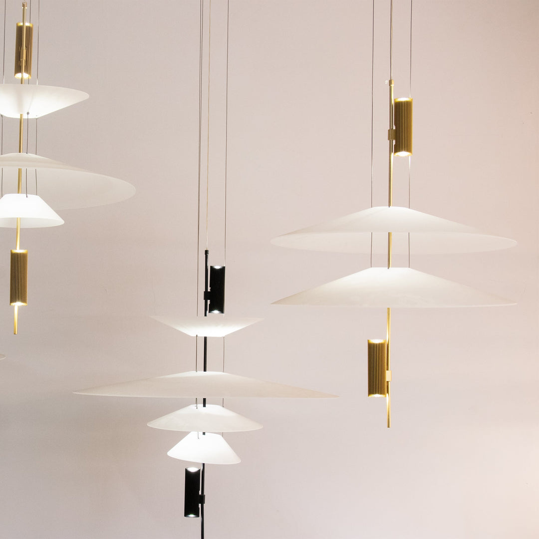 Statement Merru modern disc LED pendant light in gold, capturing attention.