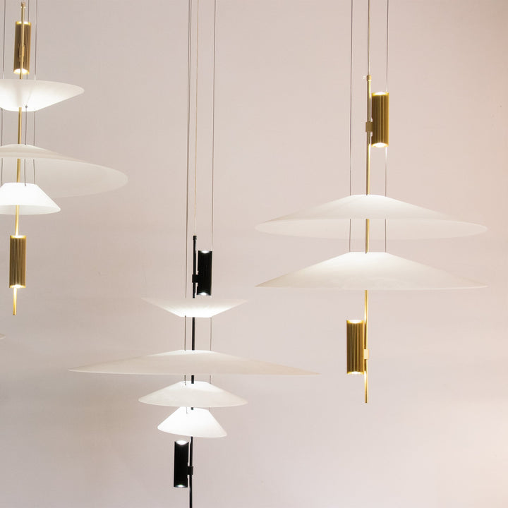 Statement Merru modern disc LED pendant light in gold, capturing attention.