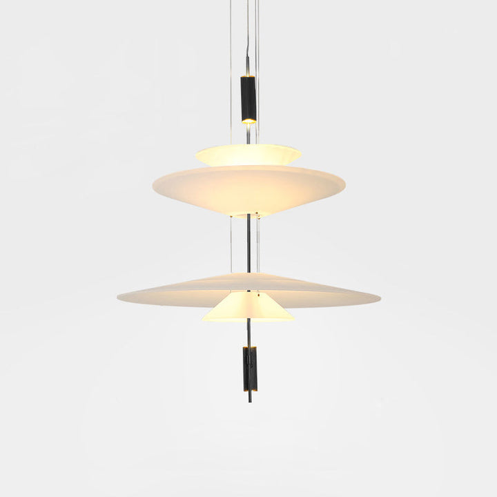 Gold Merru LED pendant light, a captivating focal point over a dining table.
