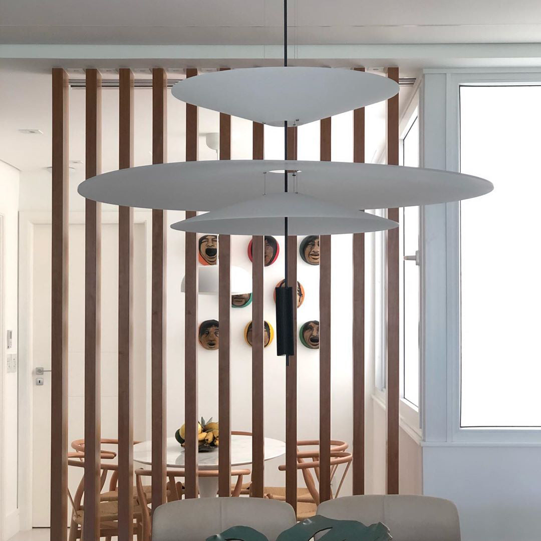 Elegant Merru gold LED disc pendant, creating a welcoming glow in hallways.