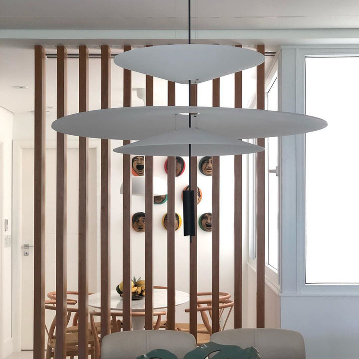 Elegant Merru gold LED disc pendant, creating a welcoming glow in hallways.