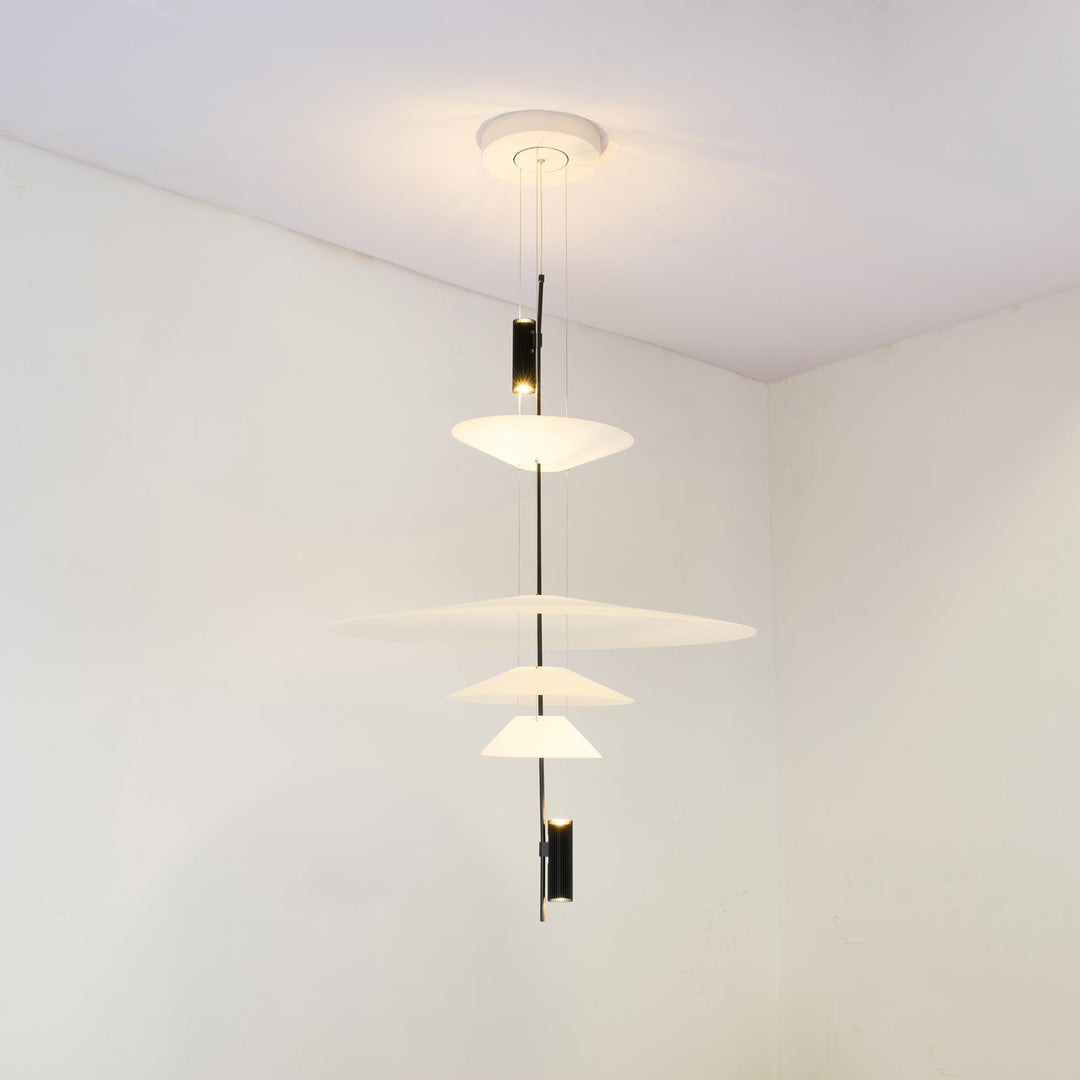 Black Merru modern disc LED pendant light, sleek and stylish for dining.