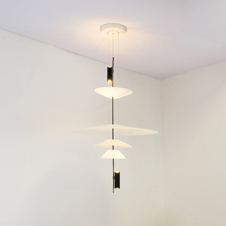 Black Merru modern disc LED pendant light, sleek and stylish for dining.