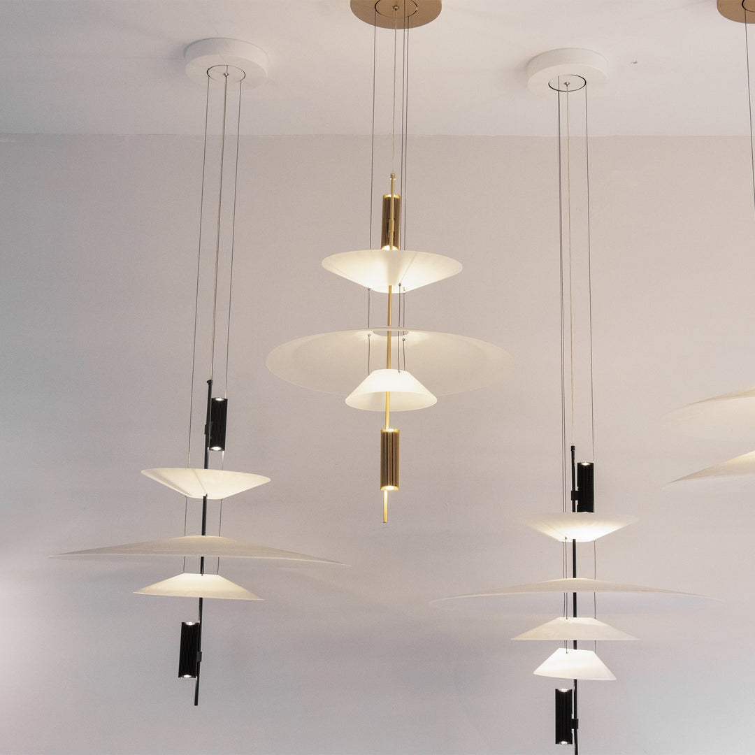 Gold Merru modern disc LED pendant light, adding luxury to kitchen islands.