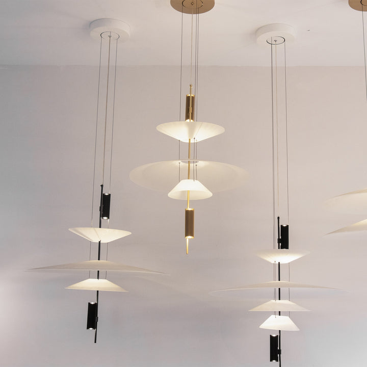 Gold Merru modern disc LED pendant light, adding luxury to kitchen islands.