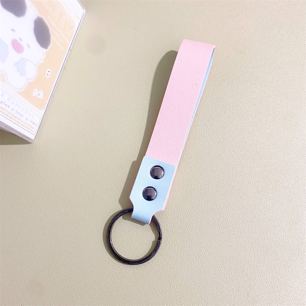 Handcrafted minimalist leather keychain, highlighting durable material and sleek design.