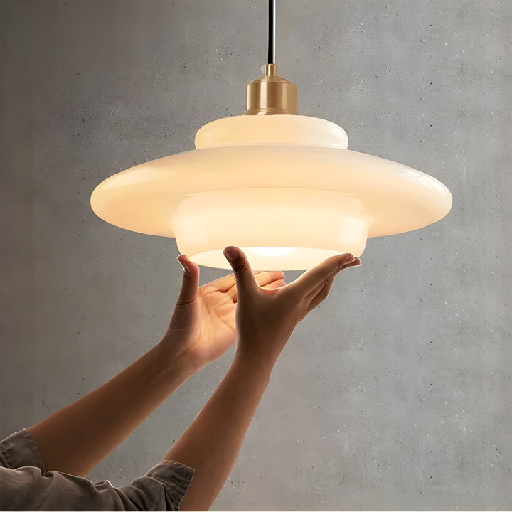 Ivory glass LED hanging light, a modern and elegant home decor piece.