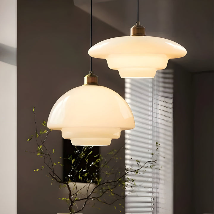 Modern LED pendant lamp with a sophisticated ivory glass finish.