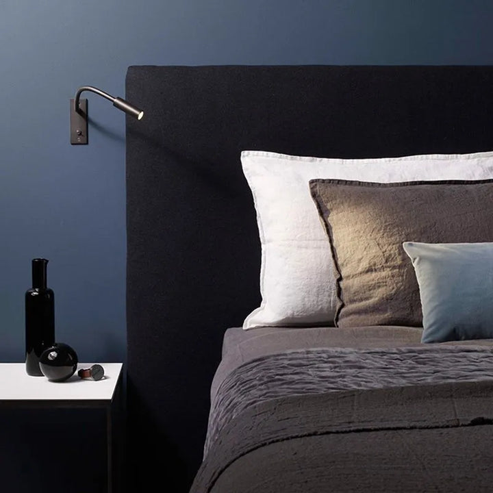 Stylish home decor LED wall lamp, a modern and minimalist reading light for comfortable bedroom ambiance.