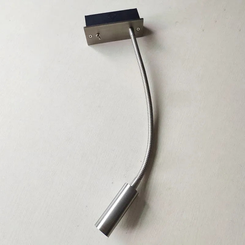Modern minimalist LED wall lamp for reading, durable metal construction, ideal as a bedroom lighting fixture.