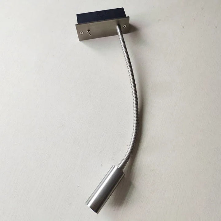 Modern minimalist LED wall lamp for reading, durable metal construction, ideal as a bedroom lighting fixture.