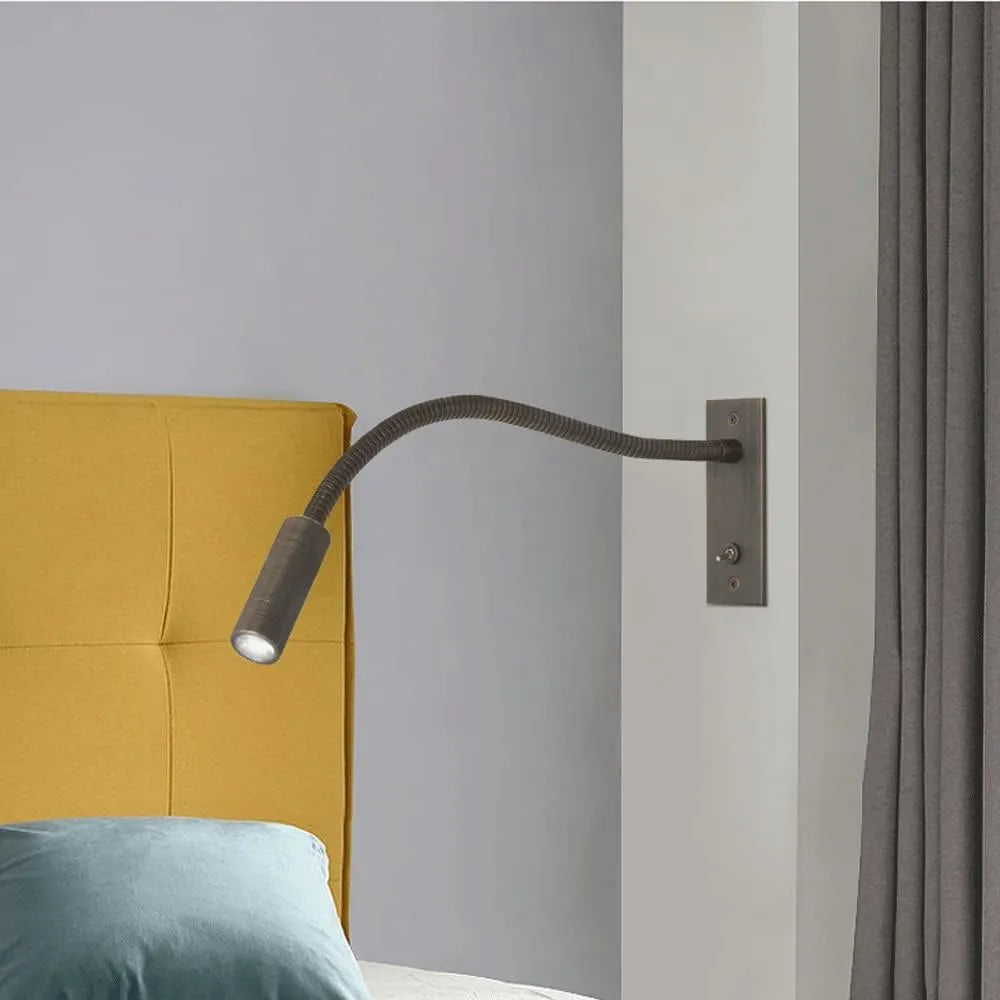 Adjustable LED reading light, a sleek minimalist indoor wall lamp perfect for focused task lighting in bedrooms.