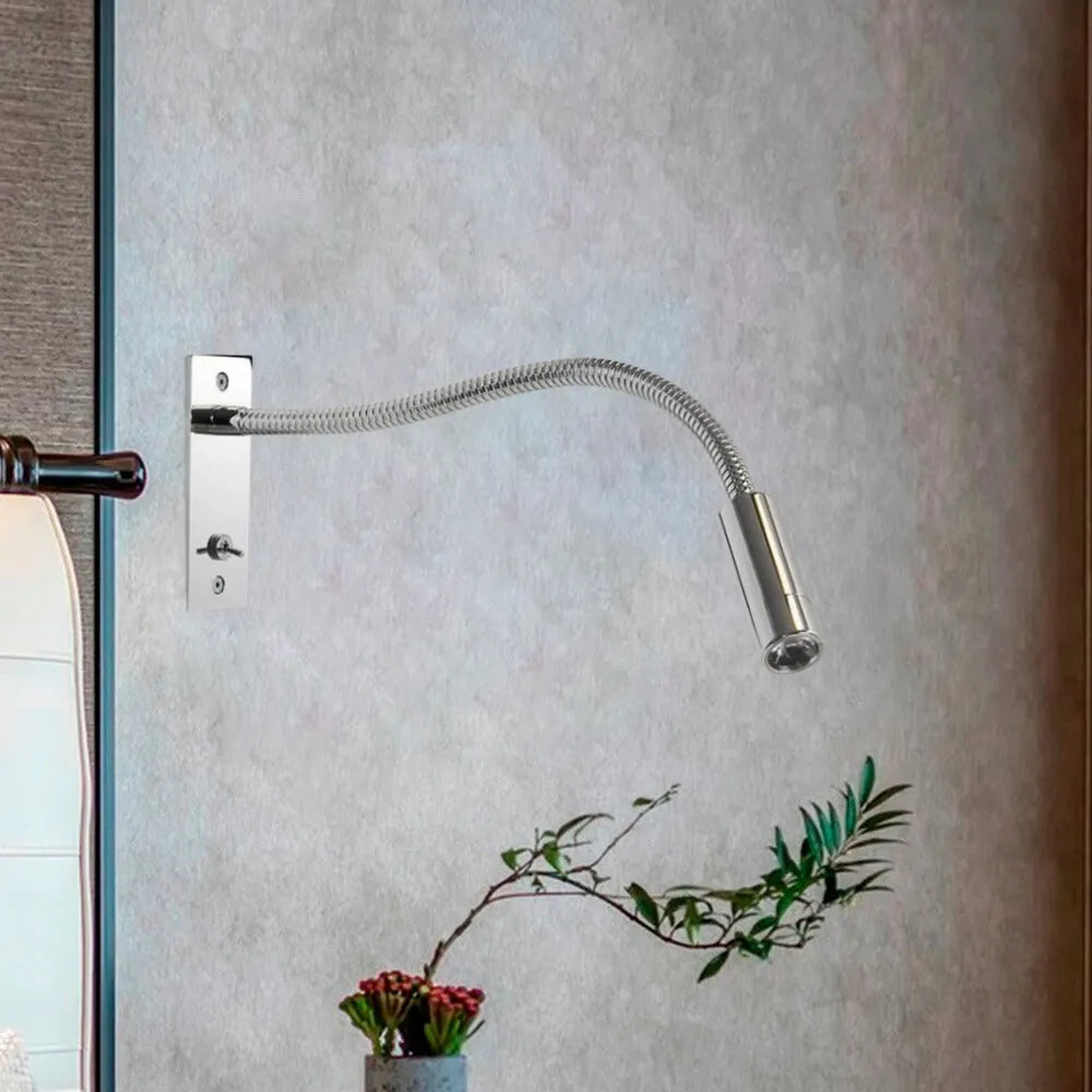 Elegant minimalist LED wall lamp, a modern metal design providing bright, adjustable light for any indoor space.
