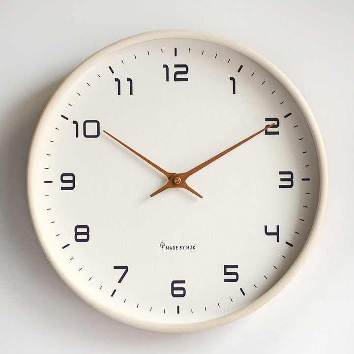 Minimalist silent wall clock with light wooden frame, perfect for modern home decor.