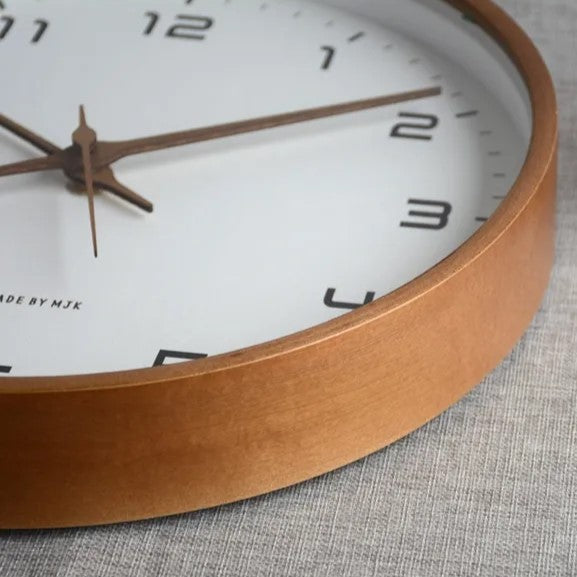 Modern minimalist wall clock with sleek wooden frame, ideal silent decor for living room or office.