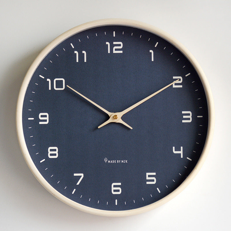 Silent wall clock with light wood frame, perfect minimalist decor for a tranquil bedroom.