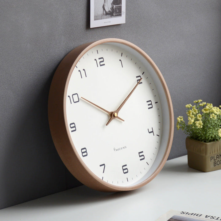 Clear face minimalist wall clock with wooden frame, silent design perfect for office or study decor.
