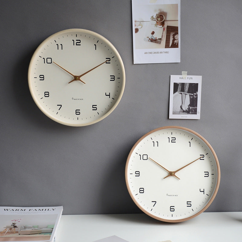 Clean design silent wall clock with a light wooden frame, enhancing modern minimalist home interior.