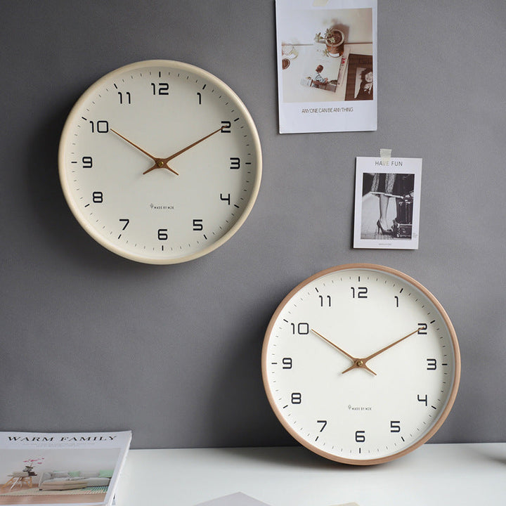 Clean design silent wall clock with a light wooden frame, enhancing modern minimalist home interior.