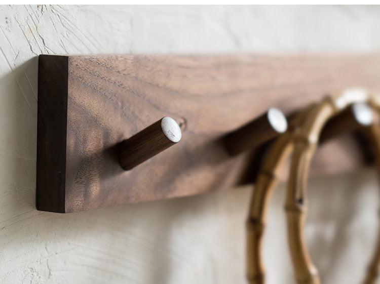 Minimalist wooden wall coat rack with Zen design & natural finish. Perfect for entryway organization & Japandi decor.