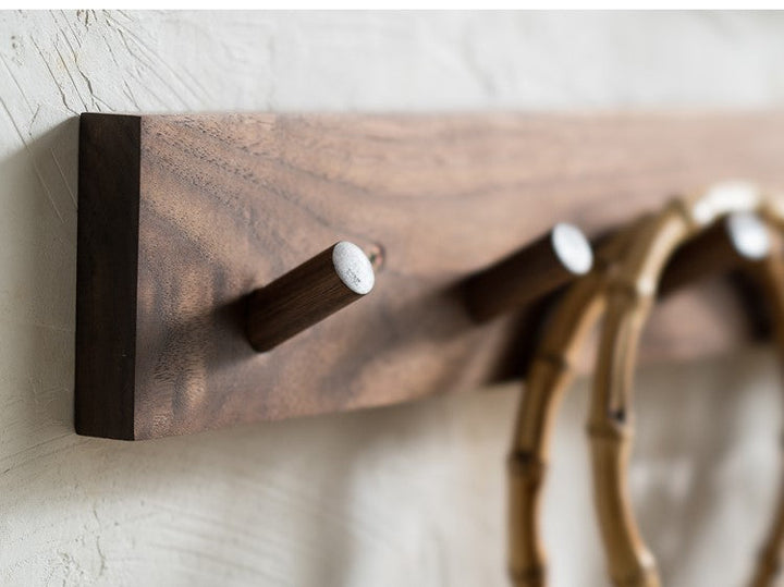 Minimalist wooden wall coat rack with Zen design & natural finish. Perfect for entryway organization & Japandi decor.