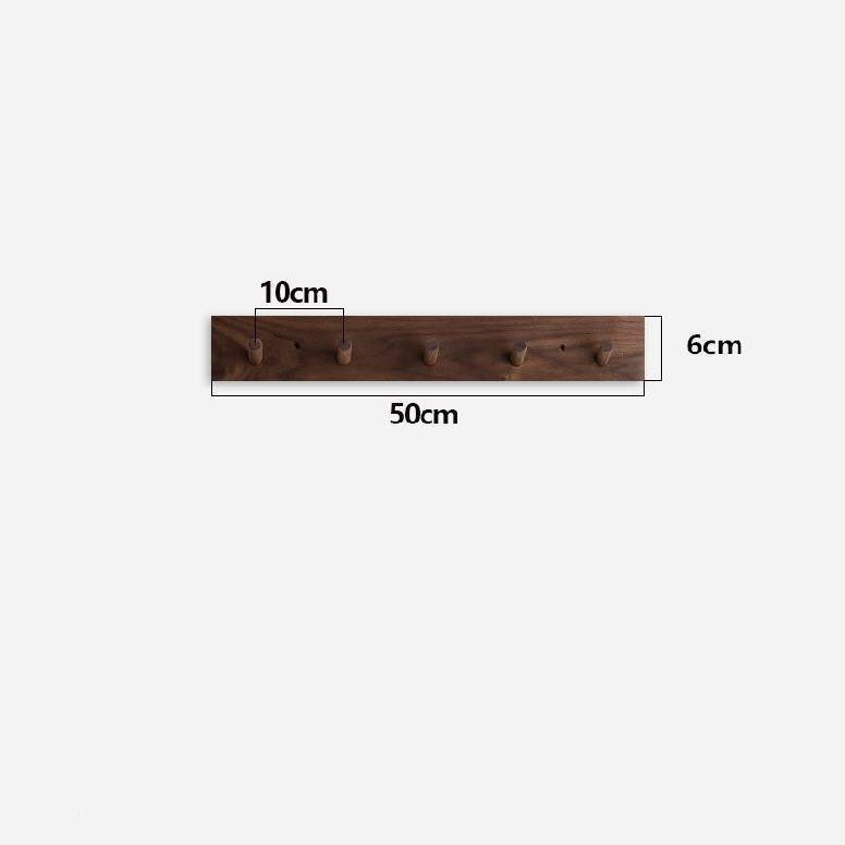 Wooden minimalist coat rack, natural finish, perfect for Japandi style entryways. Wall-mounted for organization.