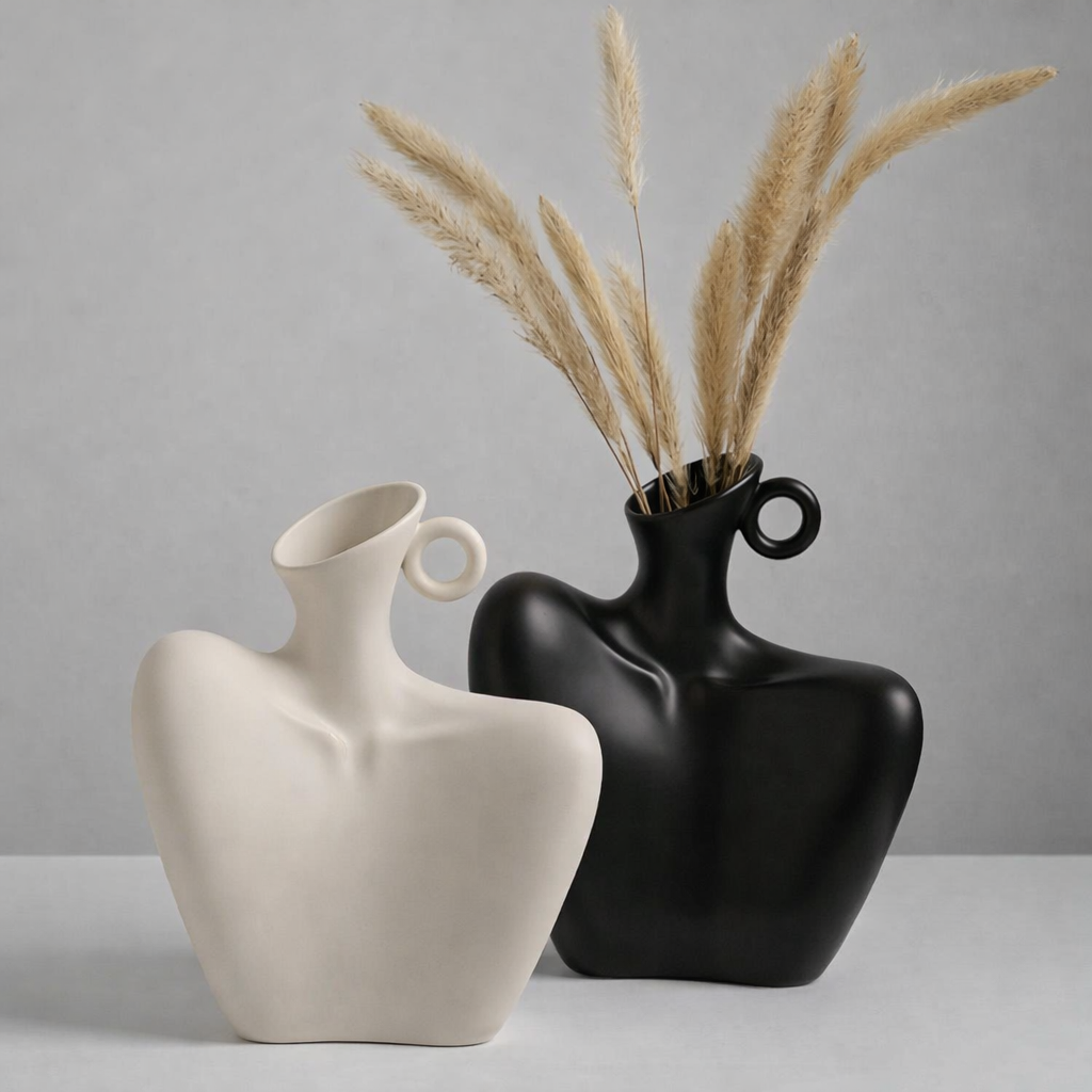 Modern abstract ceramic decorative vase, artistic white and black design for stylish home decor & interior design.