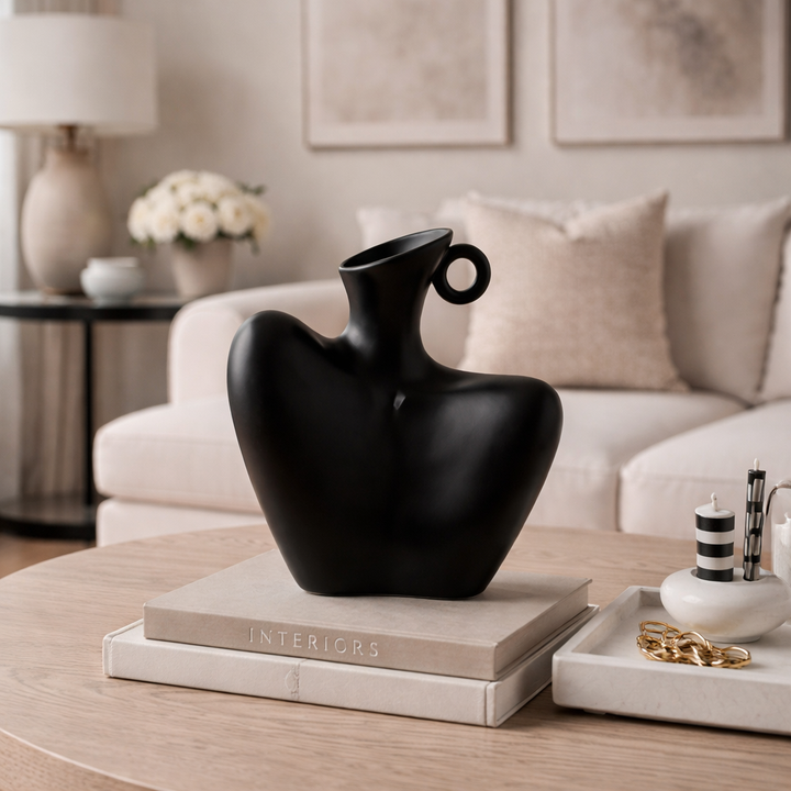 Artistic white or black abstract ceramic vase, modern decorative home accent for contemporary interior design.