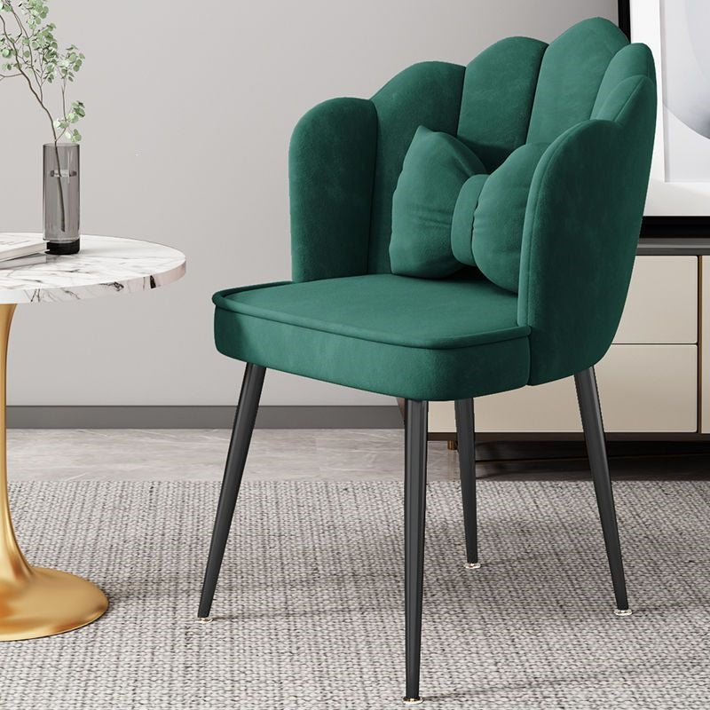Luxurious pink accent chair, golden metal legs, statement piece for home.