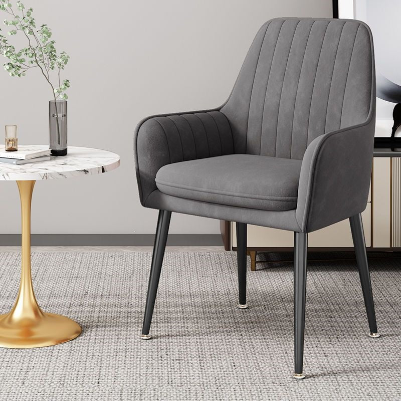 Contemporary blue accent chair, sleek gold legs, versatile design.