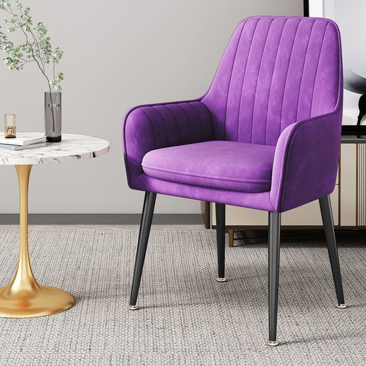 Comfortable fabric accent chair, golden legs, ideal for reading nooks.