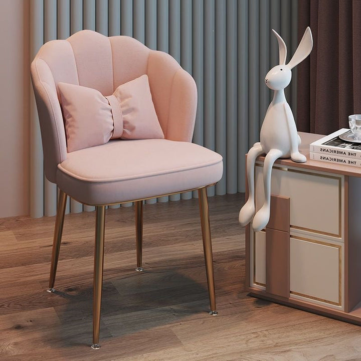 Stylish home office chair with golden metal legs, comfortable seating.