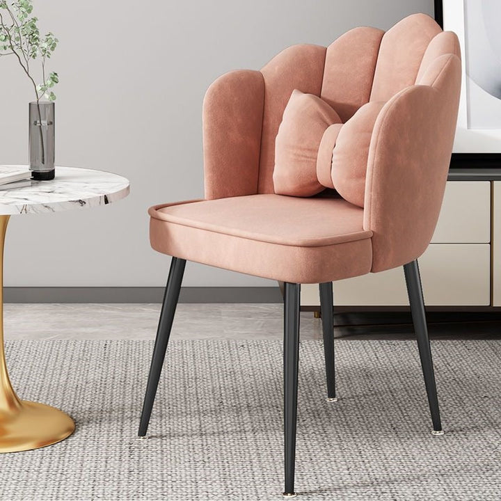 Modern rounded accent chair, gold legs, unique style for living areas.