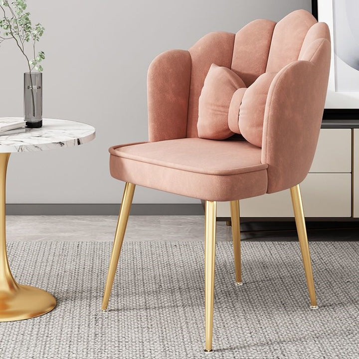 Glamorous accent chair with gold finish legs, enhancing any home interior.