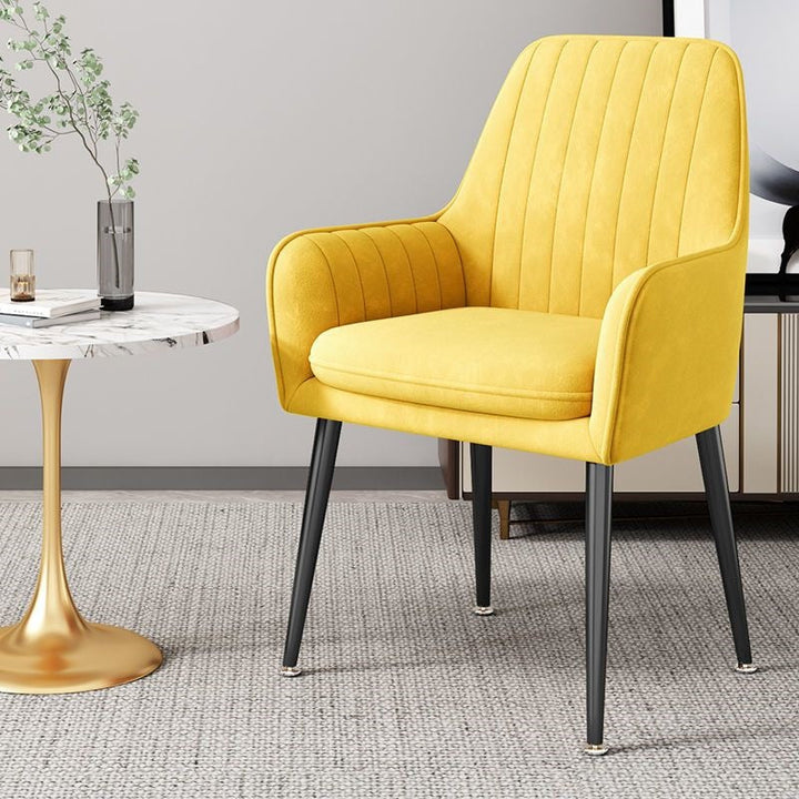 Plush comfortable accent chair, gold legs, ideal for relaxing at home.