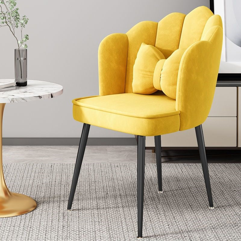Statement accent chair with bold gold legs, eye-catching modern design.