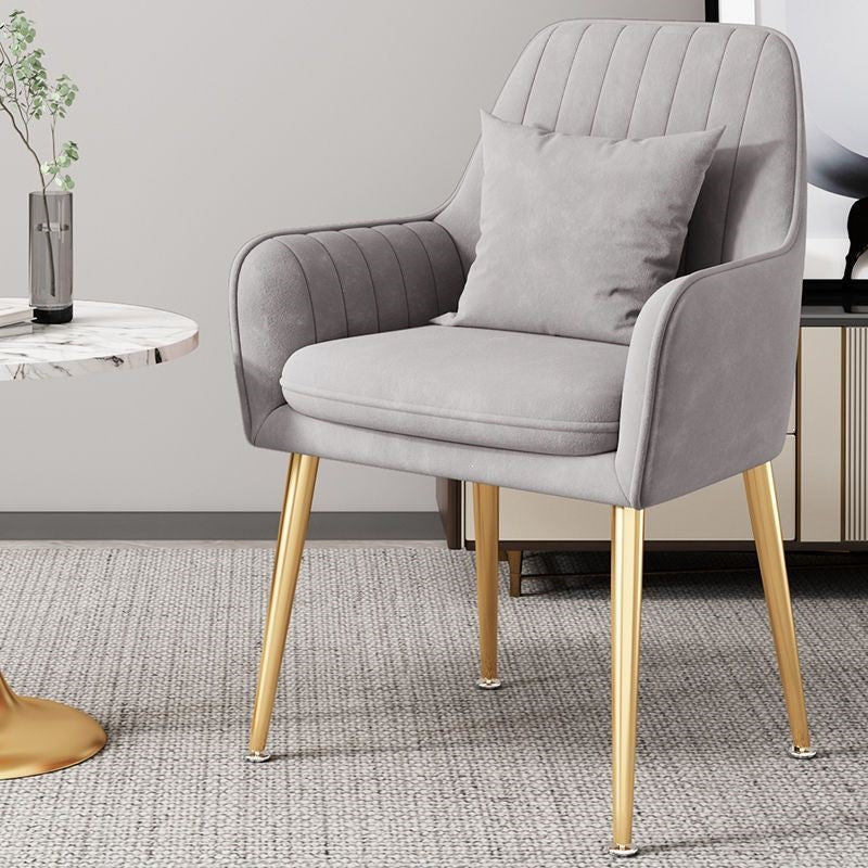 Chic gold leg chair, versatile seating for dining, office, or vanity.