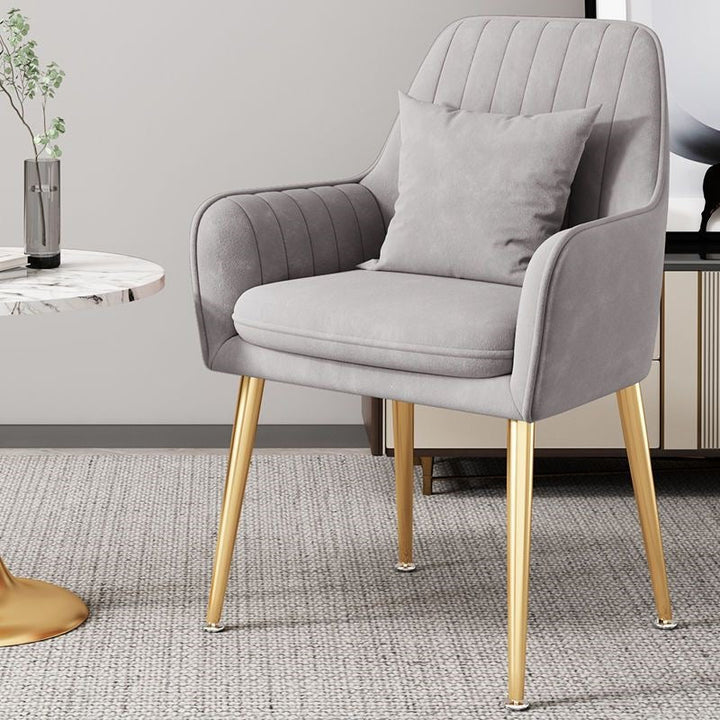 Chic gold leg chair, versatile seating for dining, office, or vanity.