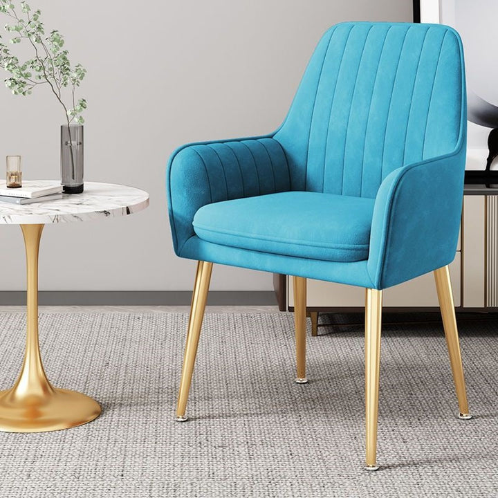 Elegant velvet accent chair, sturdy gold legs, timeless contemporary piece.