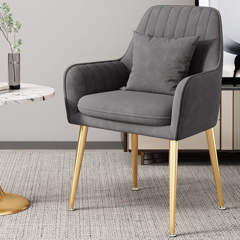 Luxurious accent chair, gold finish legs, embodying modern elegance.