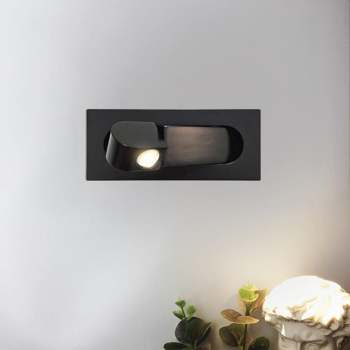 Modern adjustable LED wall lamp, ideal for bedside reading; sleek design in varied finishes.