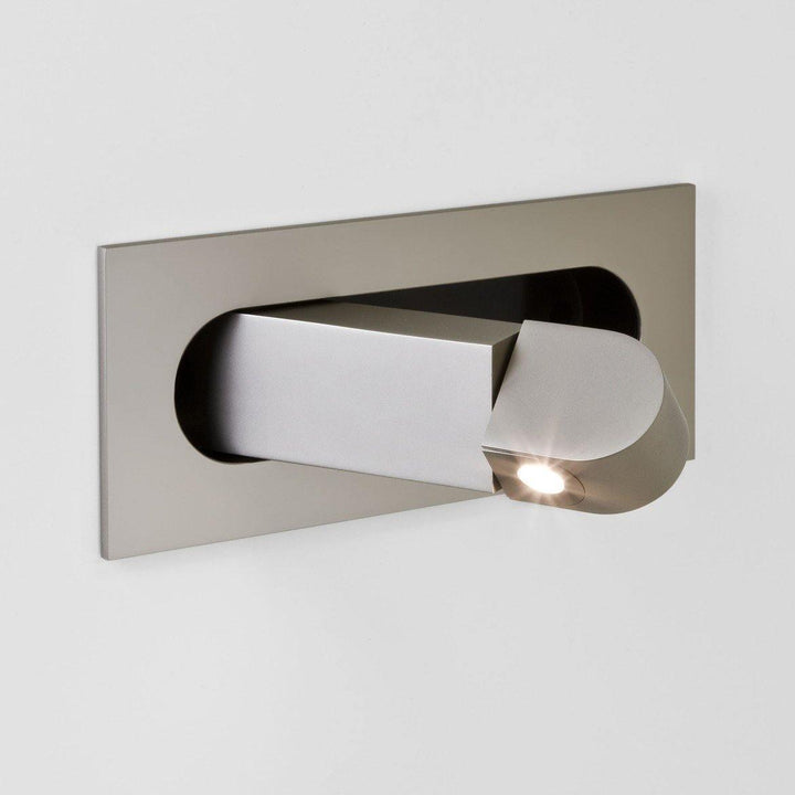 Modern LED wall light, adjustable for bedside reading; perfect for any bedroom style.