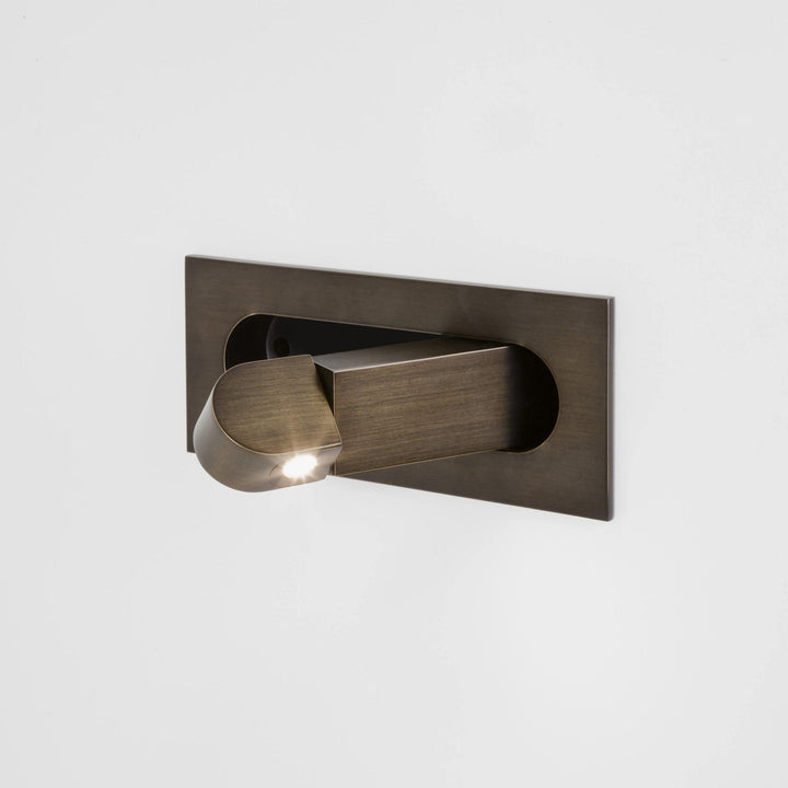 Adjustable LED bedroom light, modern wall fixture, providing directional light for comfort.