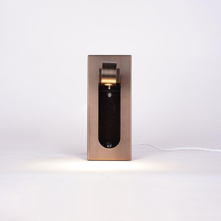 Energy-efficient LED wall light, contemporary, with an adjustable arm for optimal reading.